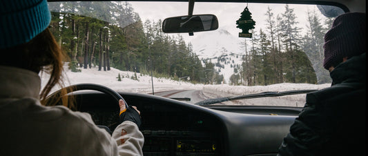 Driving along a snowy mountain pass in a truck