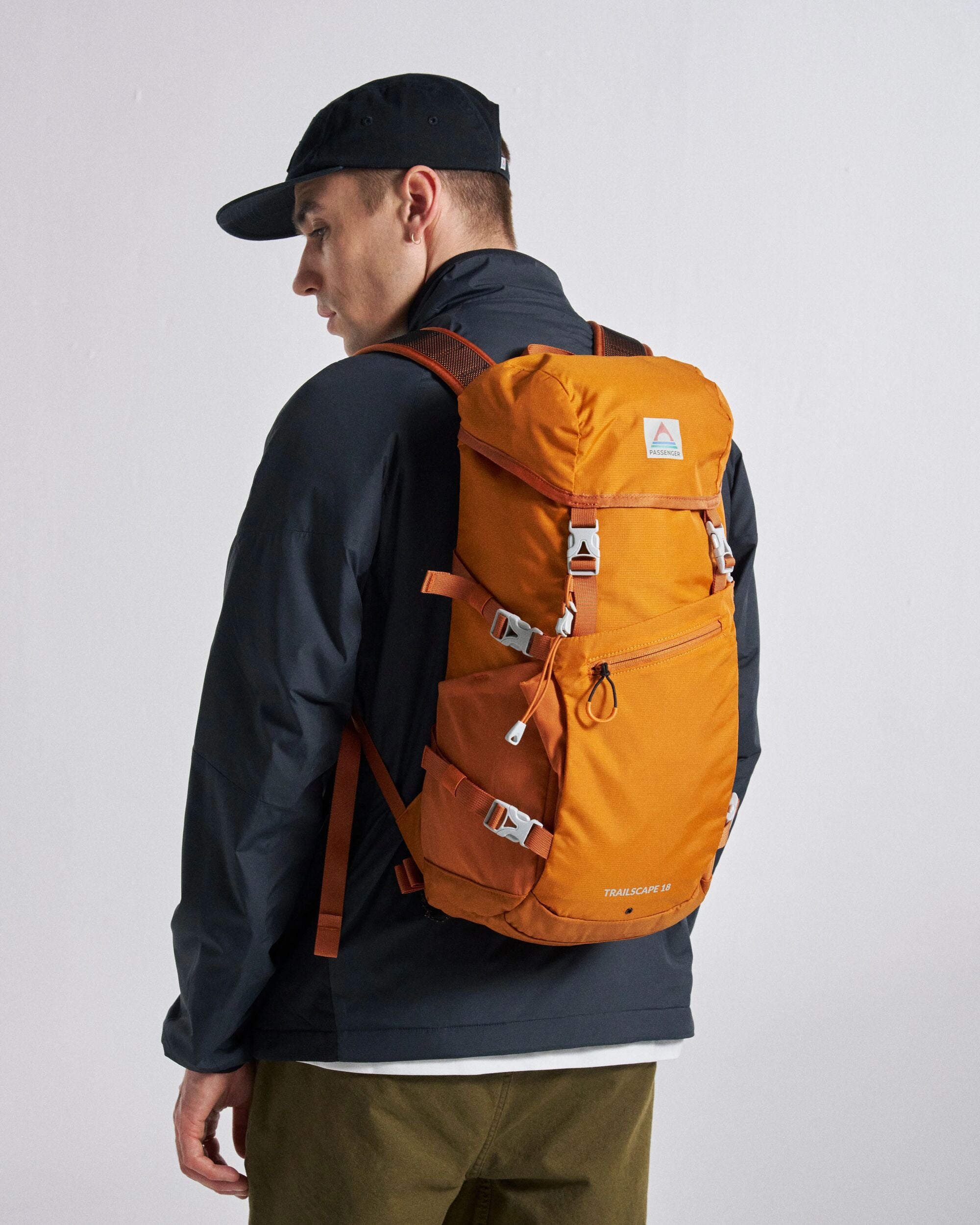Trailscape Recycled 18L Backpack - Sunrise Orange - Studio Model - Male